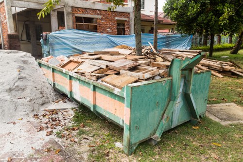 Team setting up labelled sustainable rubbish area at an office clearance in Surbiton