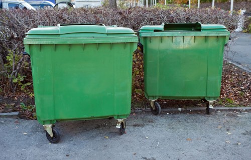 Construction site with organized waste clearance in Surbiton